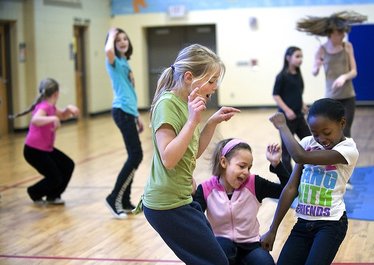 Tirzah Kauffman, foreground, from left, joins fellow 9 year olds Ralaiya Bolds and Maia Payton in a Monday afternoon dance activity at the Boys &amp; Girls Club of Southwest Washington.