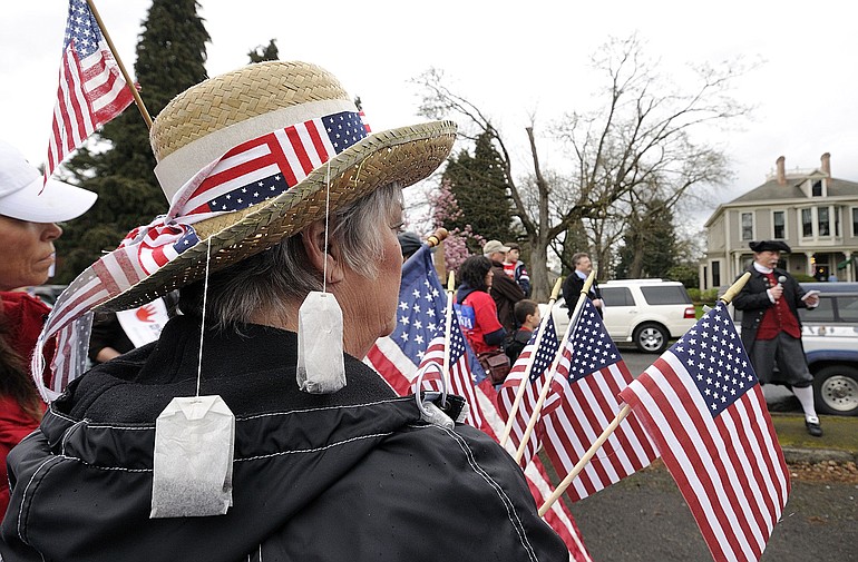 Shari Parsons of Vancouver wore a straw hat adorned with tea bags when she attended a protest rally against health care reform Tuesday outside the Vancouver office of U.S. Rep.