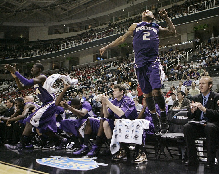 Washington guard Isaiah Thomas (2) jumps in the air from the bench in the final seconds of Washington's 82-64 win over New Mexico.