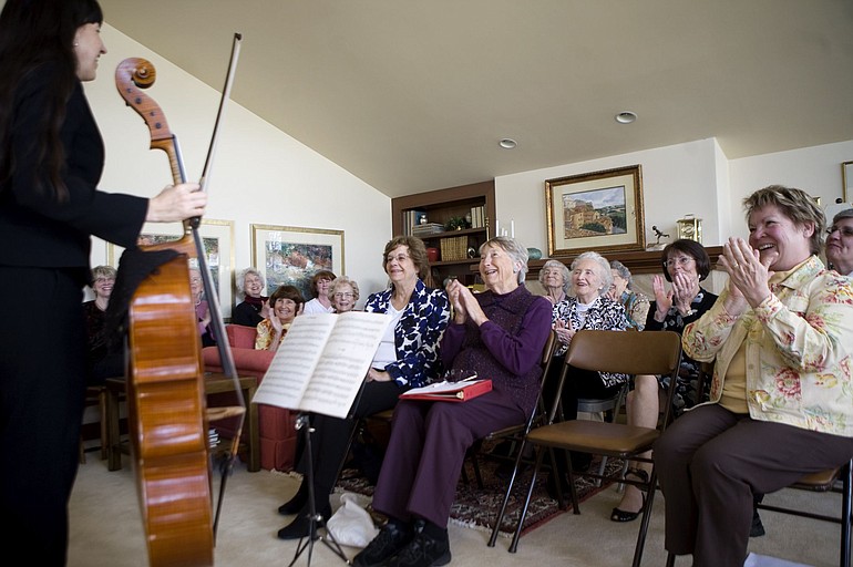 The Athenaeum is a longtime Vancouver group of women who meet monthly for scholarship and camaraderie. This year, they're studying composers. Nancy Ives, left, Oregon Symphony principal cello and a relative of the American composer Charles Ives, performs at the group's guests day.