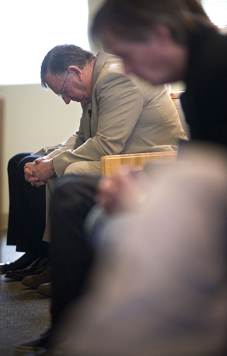 Retiring preacher Ron Higgins prays before taking the pulpit at the Hockinson Church of Christ on March 28, his last Sunday in the job.