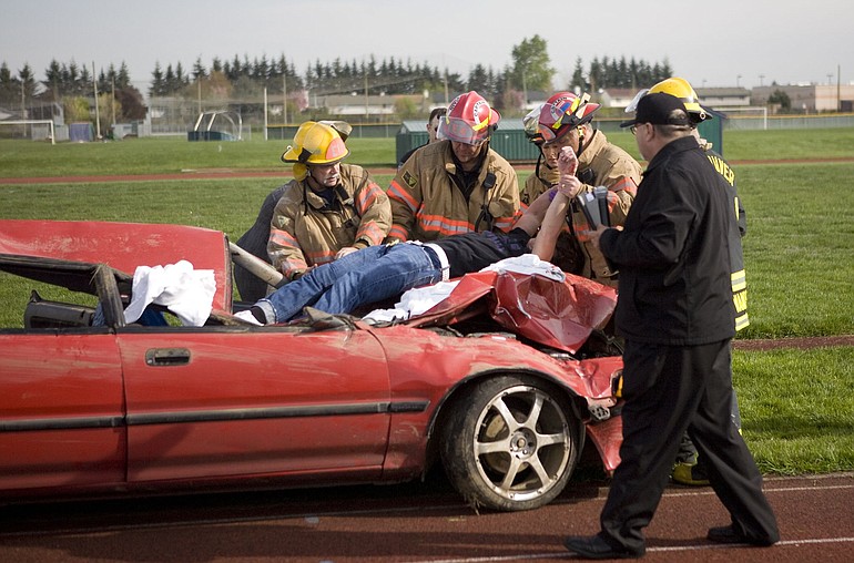 Students and rescuers bring realism Friday to a simulated DUI crash at Heritage High School.