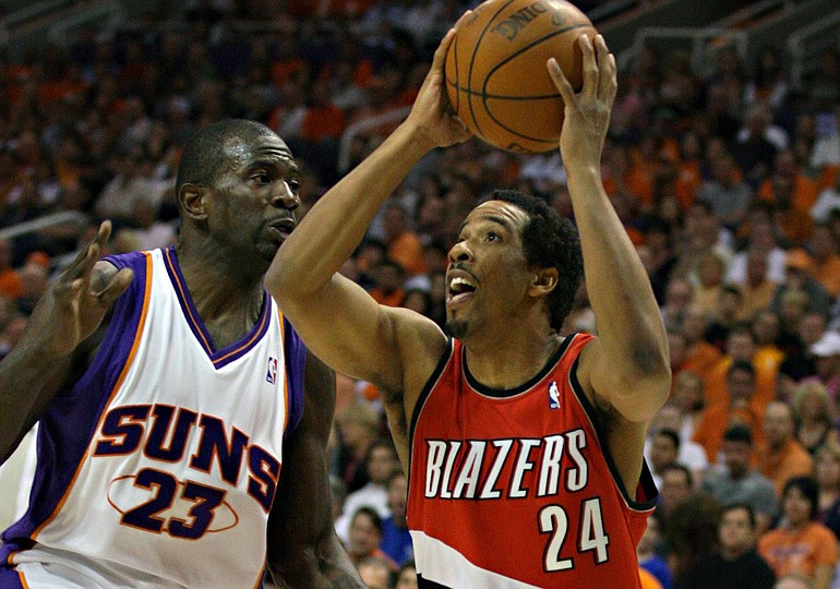 Portland's guard Andre Miller (24) shoots over Phoenix's Jason Richardson (23) during the first half of Game 1 Sunday.