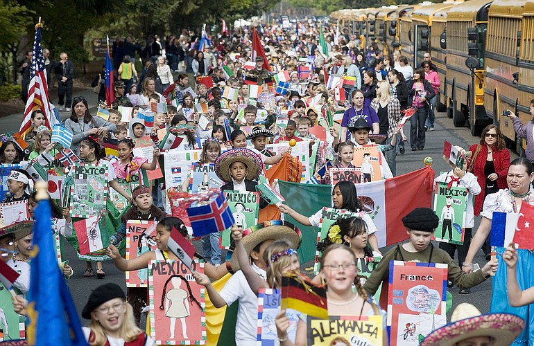 Local third-graders march in the annual Children's Cultural Parade on Friday, along Southeast Fifth Street near the Fort Vancouver National Historic Site.