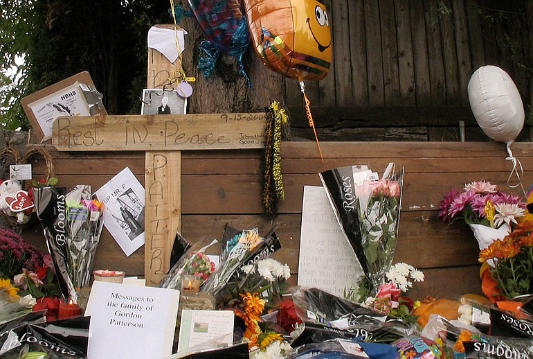Flowers, cards and mementos were left near the site where Hudson's Bay teacher Gordon Patterson was killed while riding his bicycle on Sept.