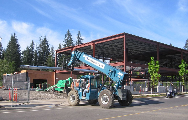 Construction crews from Tualatin, Ore.-based Perlo Construction work on the 192nd Avenue Plaza at the corner of 192nd and Southeast 20th Street in east Vancouver.