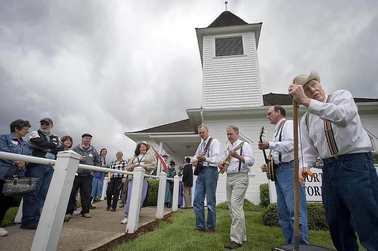 The Fern Prairie String Band -- George Parsons, from left, Jon Englund, Art Newland and Ray Drake -- play &quot;Little White Church&quot; for a crowd at the 100th anniversary celebration of the Amboy United Brethren Church and North Clark Historical Museum on Saturday.