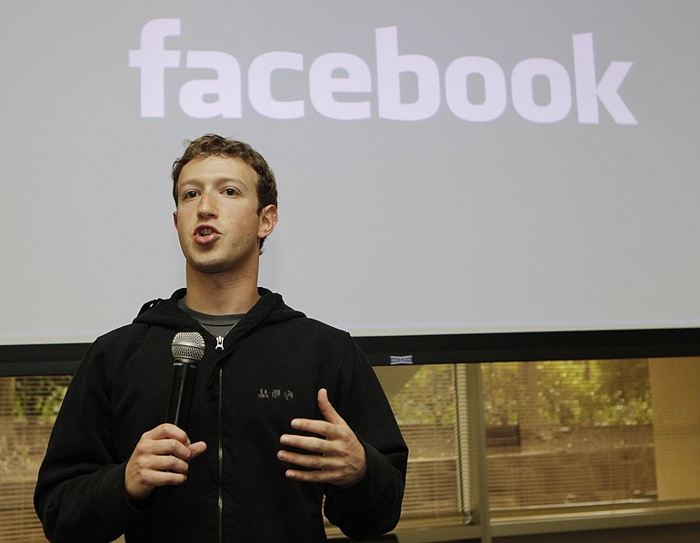 Facebook's Mark Zuckerberg holds a news conference Wednesday at the company's Palo Alto, Calif., headquarters.