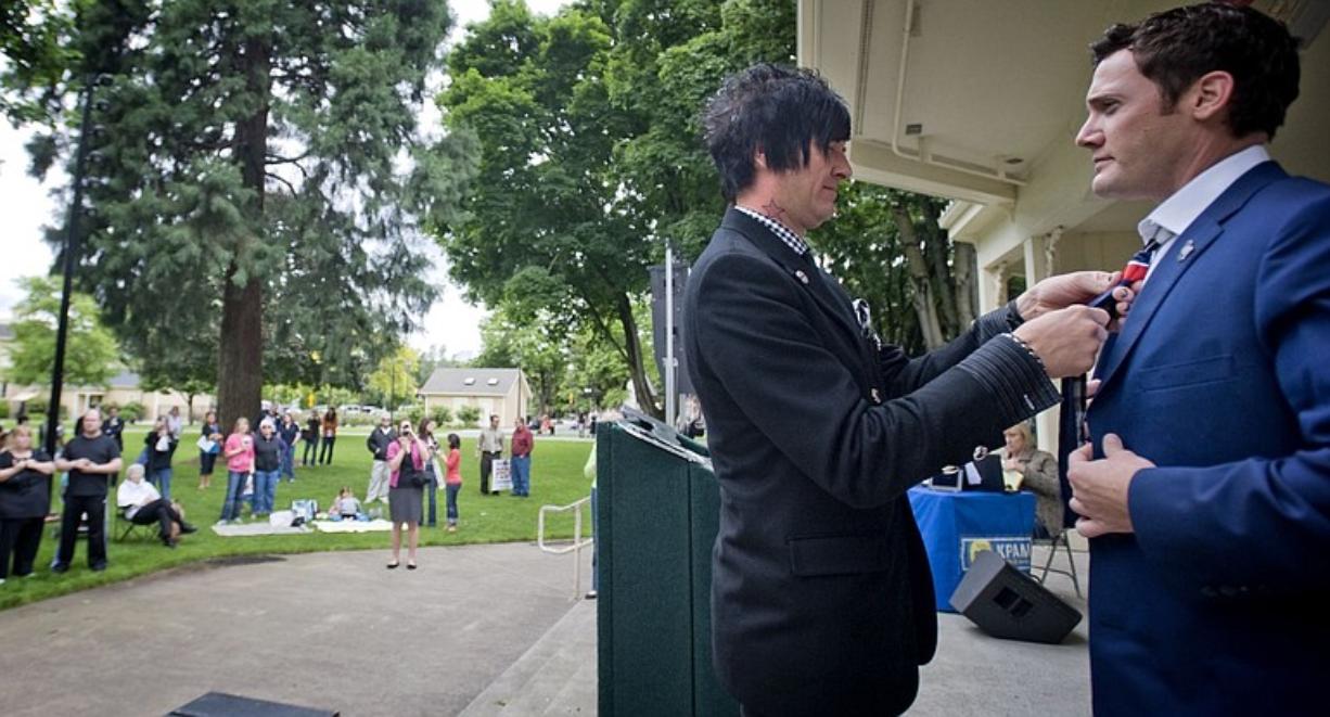 SethAaron Henderson helps Vancouver Mayor Tim Leavitt with a tie that Henderson designed after Leavitt presented with a key to the city Friday during a GOP-sponsored community celebration in Esther Short Park.
