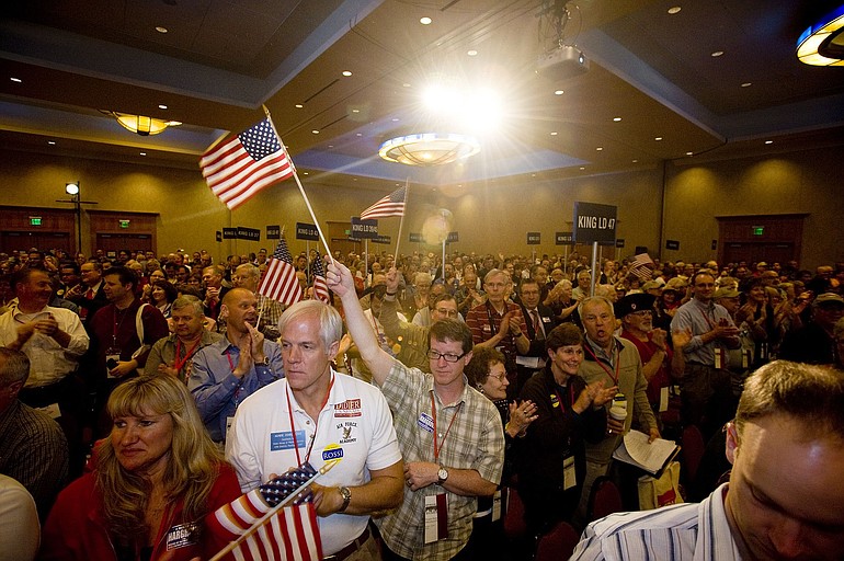 Delegates cheer Gov. Mitt Romney during the 2010 Washington State Republican Party Convention in Vancouver on Saturday.