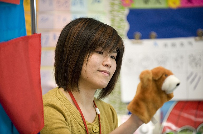 Teacher Hsin-yi Hu works with kindergarten students in Franklin Elementary's first-year Chinese immersion program.