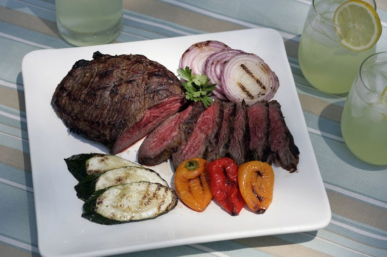 Bourbon-marinated tri-tip with grilled mixed vegetables pairs well with vodka lemon coolers.
