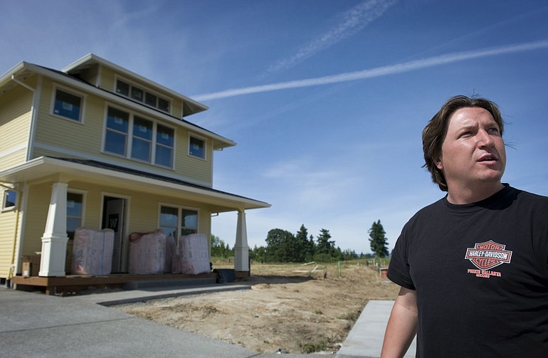 Tamarack Homes President Ryan Zygar stands in front of The Foursquare, built by his Vancouver company.