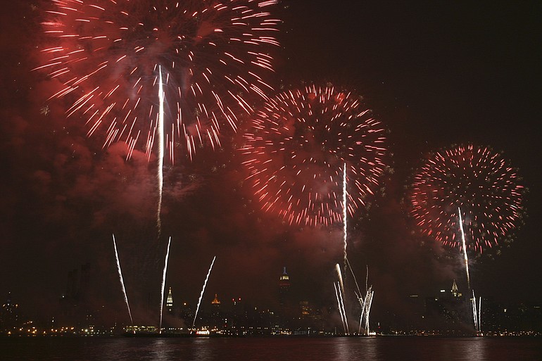 Fireworks as they explode over the Manhattan skyline. .