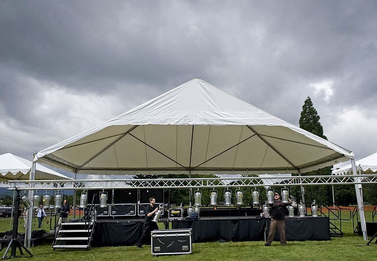 A lighting crew assembles the main stage in preparation for the resurrected Independence Day at Fort Vancouver on Friday.