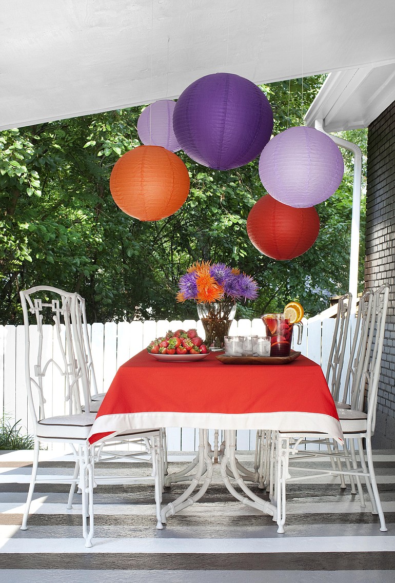 Brian Patrick Flynn uses floor paint, paper lanterns and flea market finds to create a festive outdoor dining space.