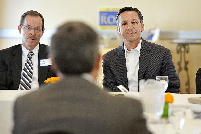 Republican U.S. Senate candidate Dino Rossi, right, listens to concerns of local business leaders, including U.S.