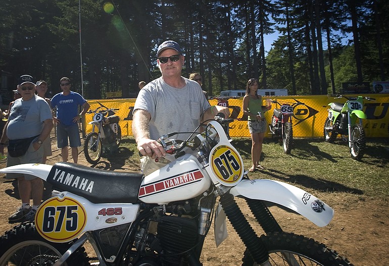 Rick Burgett, who was the 1978 National Champion from Sandy, Ore., poses next to the motorcycle that he will be riding during today's Vintage Race at Washougal MX Park.