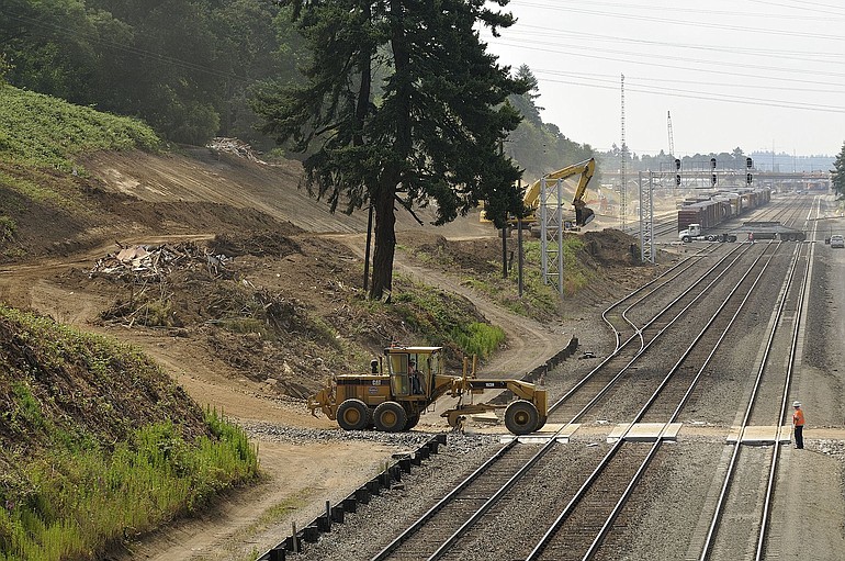 Excavators work along the west-facing slope near Fruit Valley Road to prepare for a new 3.2-mile-long set of bypass tracks designed to help ease a railroad chokepoint in Vancouver.