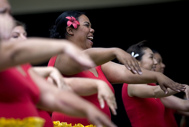 Leinq`ala Slaughter, center, of Portland, practices with her dance group Hula Halau He Makana O Aloha before taking the stage during the Ho`ike and Hawaiian Festival at Esther Short Park Saturday.