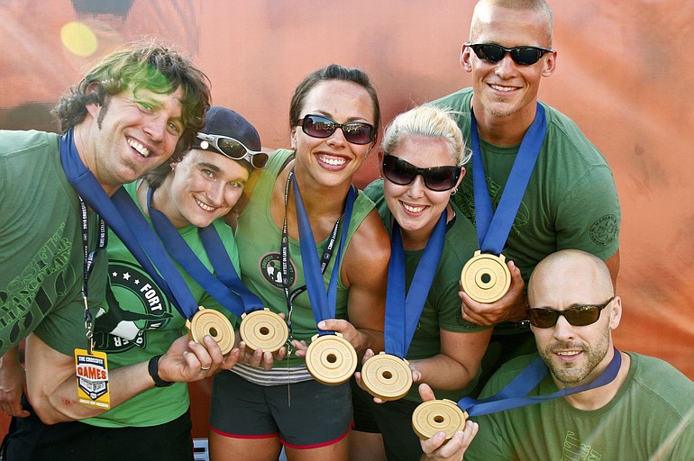 CrossFit Fort Vancouver gym members (from left) Adam Neiffer, Marie Rochat, Jessica Core, Riss Rodriguez, Ryan Smith, Nathan Loren pose with their gold medals won recently at the CrossFit World Games fitness competition in Carson, Calif.