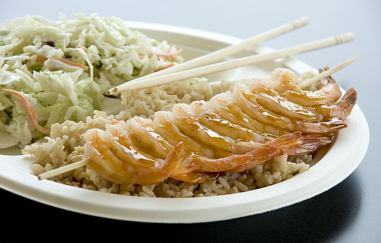 A combination plate features steamed shrimp, Asian slaw and brown rice at Over the Top Teriyaki