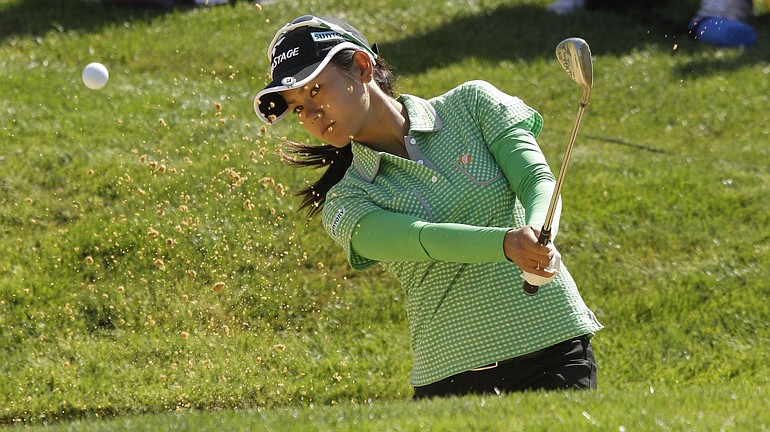 Ai Miyazato, of Japan, hits out of a sand trap on the 17th hole during the first round of the LPGA Safeway Classic at Pumpkin Ridge on Friday.