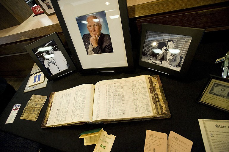 A handwritten bank ledger from the 1940s was center stage in a display of artifacts from the life of Ed Firstenburg in the lobby of First Independent Bank.