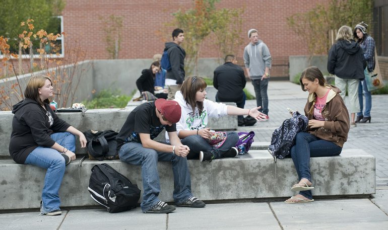 Students lounge outside the Hayes Freedom building Tuesday.