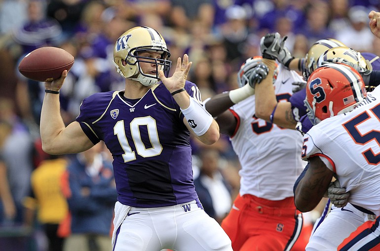 Jake Locker threw for 289 yards and tied his career high with four TD passes against Syracuse on Saturday.