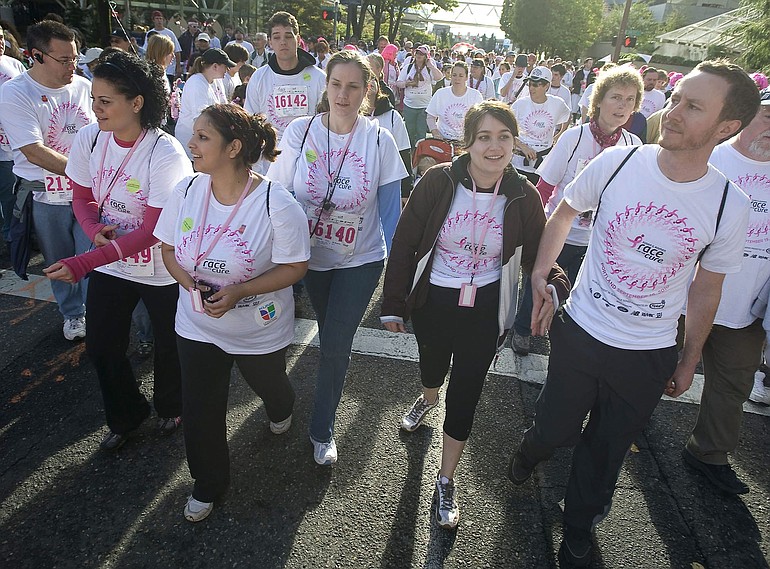Team Sea Mar members, from left, Porecha Warner, Bery Herrera, Michelle Ahmed, Elizabeth Stockdale and Jeff Knight walk down Southwest Salmon Street in downtown Portland during the Race for the Cure event on Sunday.