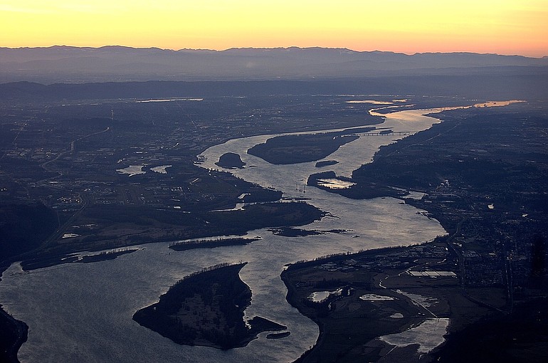The Columbia River stretches toward the west and the Pacific Ocean in this view from above Camas and Washougal.