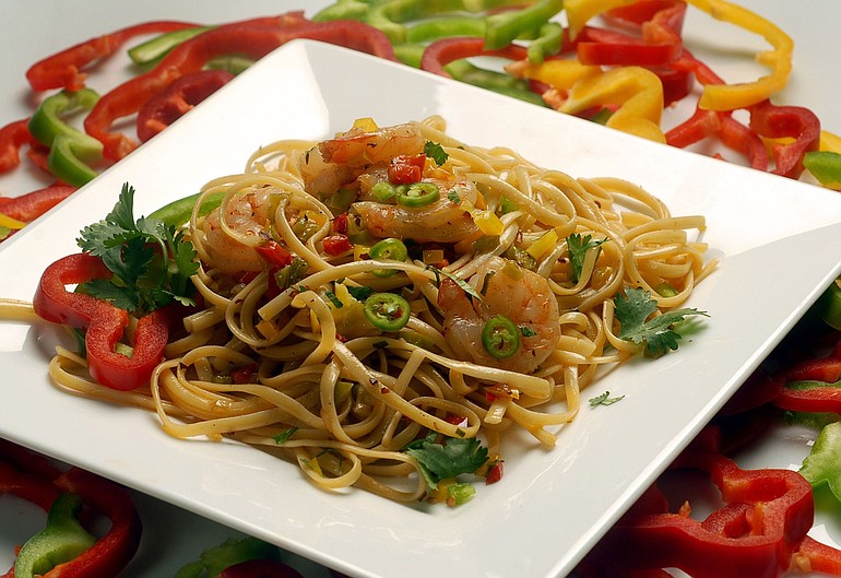 Toss diced bell and serrano peppers with tequila-simmered shrimp and linguine for a &quot;playful dish&quot; that's as easy as it is beautiful.