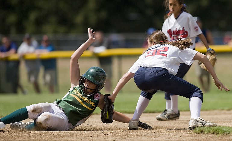 Burbank Little League shortstop Kaitlin Okimoto tags out Pendleton Little League baserunner MyKal Weissenfluh in the championship game of the 2010 Western Regional Softball Tournament at Fort Vancouver Little League field.