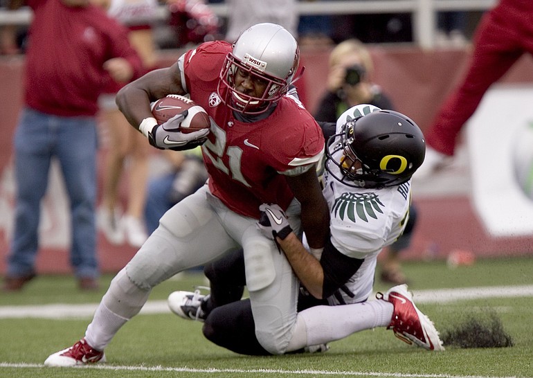 Washington State running back James Montgomery (21) scores as he is taken down by Oregon safety John Boyett during the first quarter Saturday.