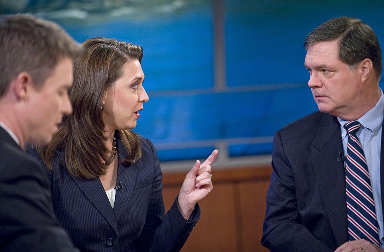 Congressional candidates Denny Heck and Jaime Herrera take a break Friday between segments during a taping of KGW's Straight Talk with moderator Russ Lewis.