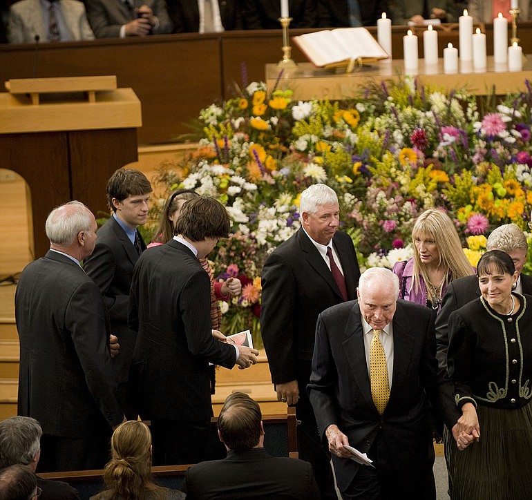 Ed Lynch, center left, leaves the Celebration of Life service of his wife, Dollie Lynch, with their daughter Susan Lynch and other family members Saturday at First United Methodist Church.
