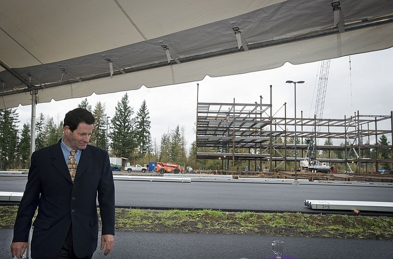 Ken Fisher, of Fisher Investments, heads back to his seat after addressing the crowd at a Tuesday event to celebrate the start of construction on the first of two office buildings that will house the company's Clark County work force.