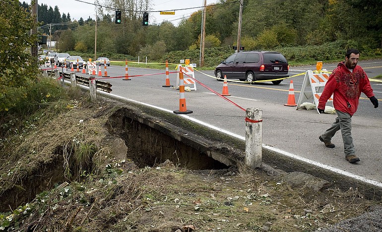 Water from heavy rain over the weekend caused a landslide, undermining a southbound lane of Highway 99 near 112th Street.