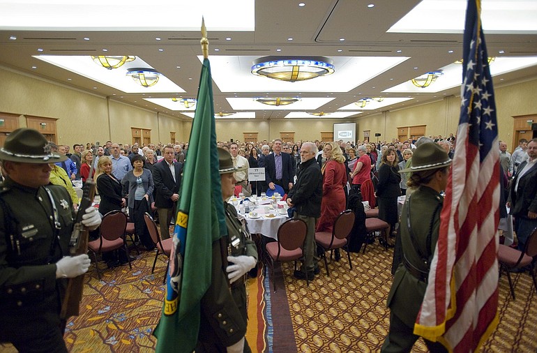The Clark County Sheriff's Honor Guard prepares to post the colors during the Clark County Mayors' and Civic Leaders' 9th annual Prayer Breakfast at the Hilton Vancouver Washington on Thursday.
