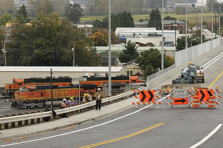 Workers wrap up some of the finishing touches on the 39th Street bridge on Tuesday.