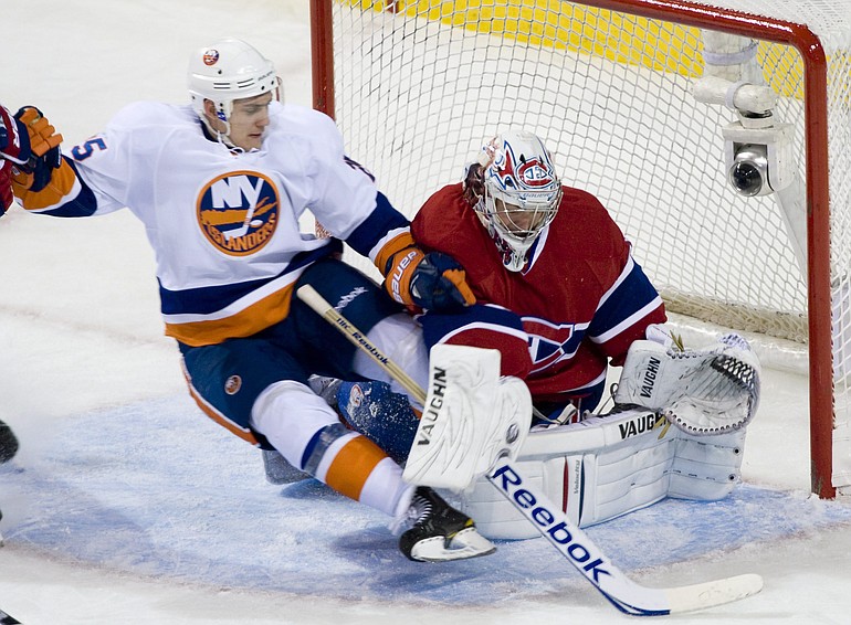 New York Islanders rookie Nino Niederreiter, left, slides in on Montreal Canadiens' goaltender Carey Price during Wednesday's game.