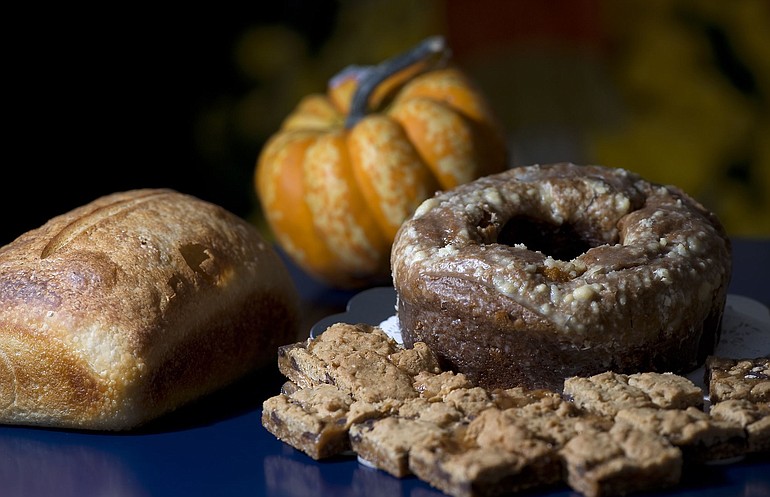A loaf of freshly baked Extra-Sourdough Bread, from left, Caramel Candy Bar Cookies and a Pumpkin Spice Pudding Ring are among the treats made at Sadie &amp; Josie's Bakery in La Center.
