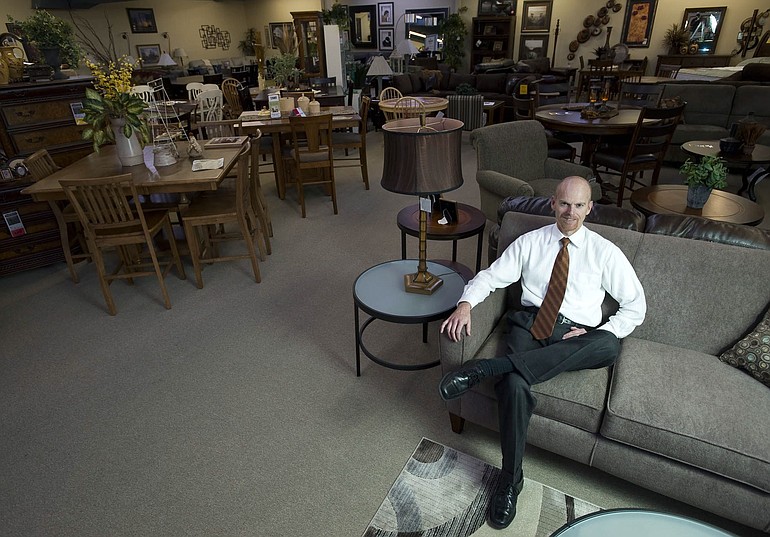 Cascade Furniture owner Jon Wright inside his showroom.