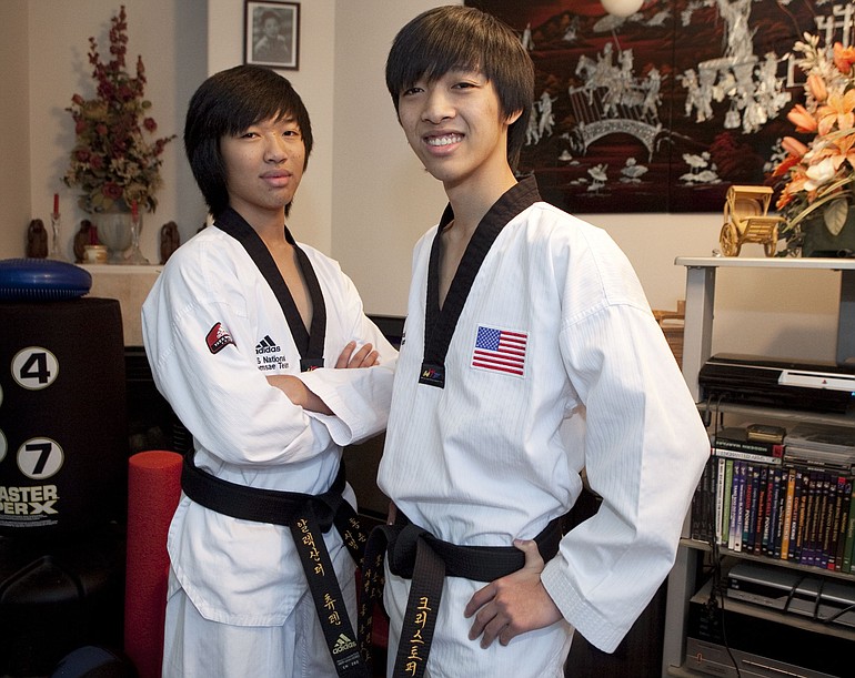 Brothers Alex Tran, 16, (left) and Chris Tran, 17, have competed internationally in taekwondo forms competition.