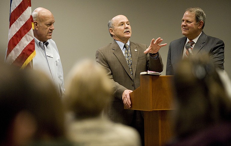 Mike Gregoire talks about his own experiences as a veteran, flanked by WSU Vancouver Chancellor Hal Dengerink, left, and John Lee, director of the Washington State Department of Veterans Affairs.
