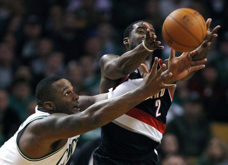 Boston Celtics' Glen Davis, left, and Portland Trail Blazers' Wesley Matthews battle for a loose ball in the third quarter of an NBA basketball game in Boston, Wednesday, Dec. 1, 2010. The Celtics won 99-95.