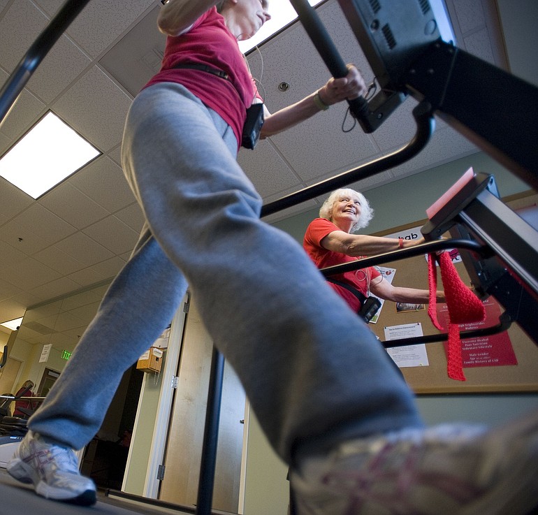 Cardiac patients Mary Ann Beck, left, and Leslea Steffel-Dennis participate in Legacy Salmon Creek Medical Center's cardiac rehab clinic, in which they exercise under the supervision of medical professionals.