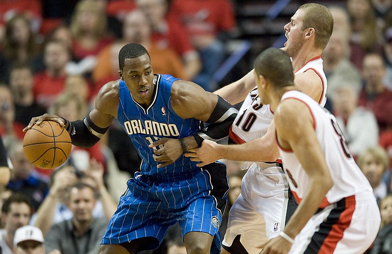 The Orlando Magic's Dwight Howard fights for position against Trail Blazers Joel Przybilla at the Rose Garden, Thursday, December 9, 2010.
