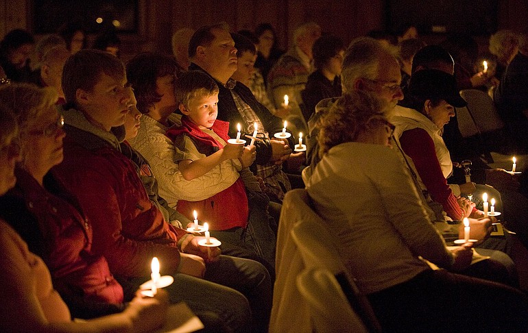 Candlelight illuminate parents, friends and family members of children who have died at Vancouver's Sunday night service, part of The Compassionate Friends Worldwide Candle Lighting.